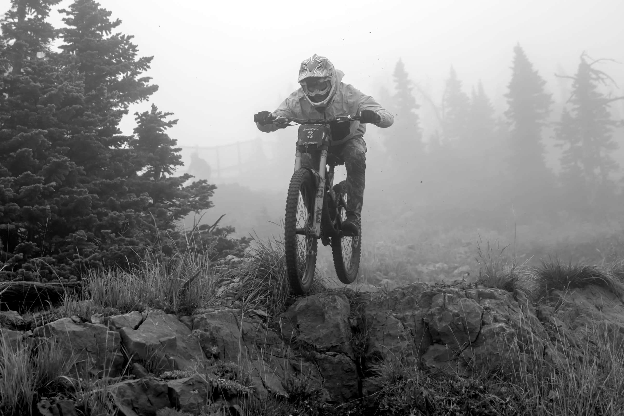 Racer dropping through the fog, black and white